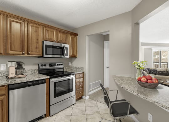 Kitchen with appliances at The Riverwood, Lilydale, MN