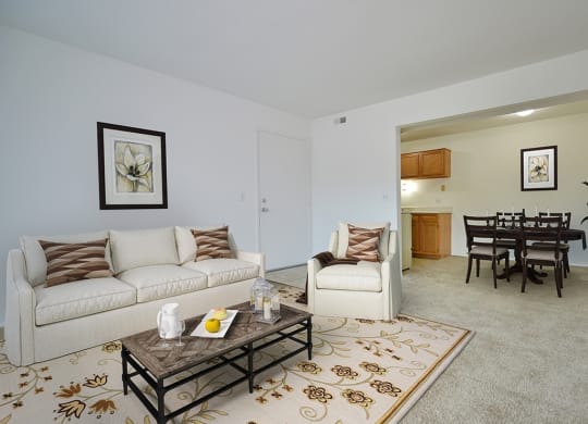 Living Room With Dining Area at Charter Oaks Apartments, Davison, Michigan