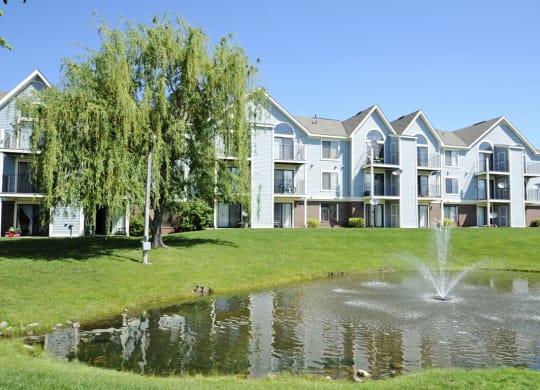 Lake With Lush Natural Surroundings at Huntington Cove Apartments, Merrillville, IN