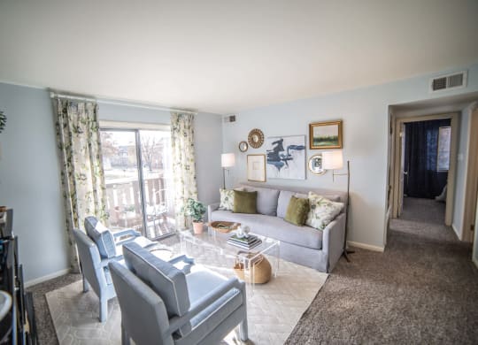 Living Room With Private Balcony at Bavarian Village Apartments, Indianapolis, 46235