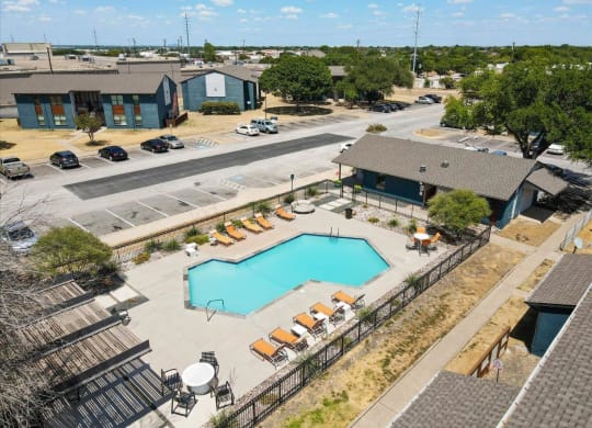 The Hangar Clubhouse and Pool with Lounge Chairs