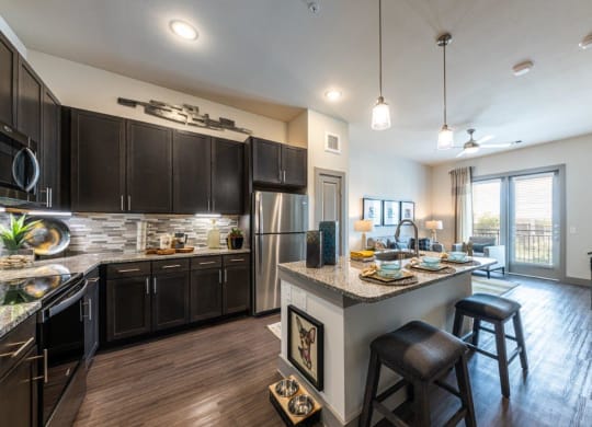 Cromwell at Plum Creek Apartments Model Kitchen and Living Room