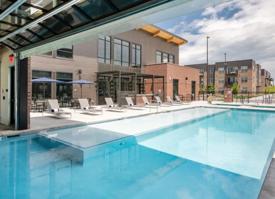 Swimming Pool Area With Shaded Chairs at Railway Flats Apartments, Colorado, 80538