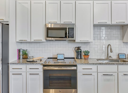 Berkshire Ballantyne epicurean kitchen with opulent white custom cabinetry
