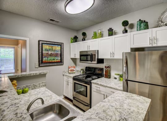 Spacious kitchen with stainless appliances at Wyndchase at Aspen Grove