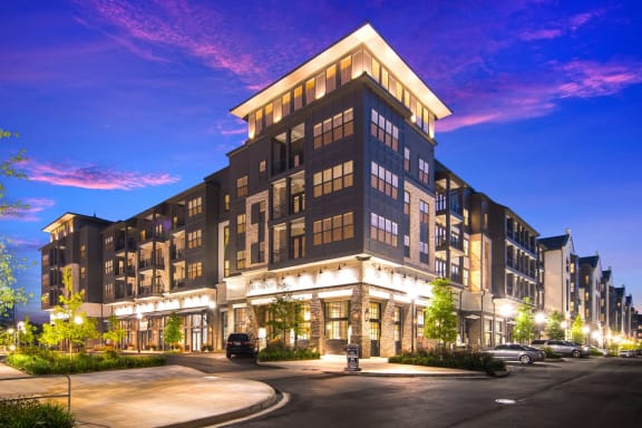 Leasing Office Exterior at Night at The Alastair at Aria Village Apartment Homes in Sandy Springs, Georgia, GA