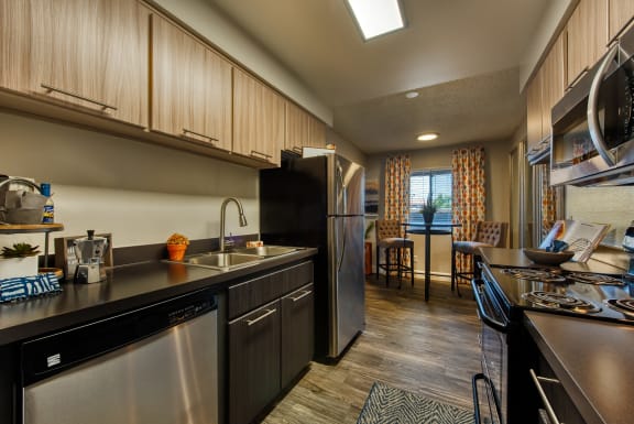Apartments in Scottsdale for Rent - Denim Scottsdale Modern Kitchen with Up-to-Date Appliances, Sleek Countertops, and Ample Cabinet Storage
