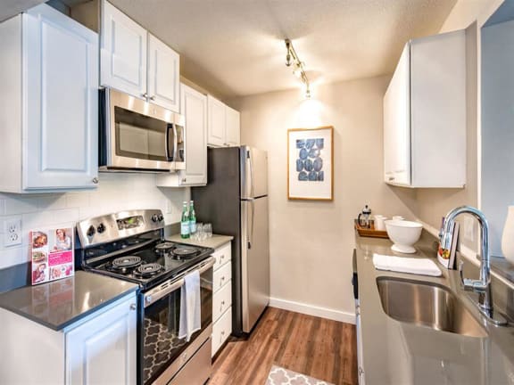 Fully Equipped Kitchen Includes Frost-Free Refrigerator, Electric Range, & Dishwasher at 81 Fifty at West Hills, Portland, OR
