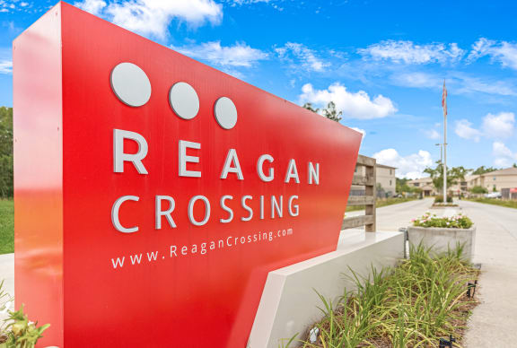 Front entrance sign at Reagan Crossing in Covington, LA