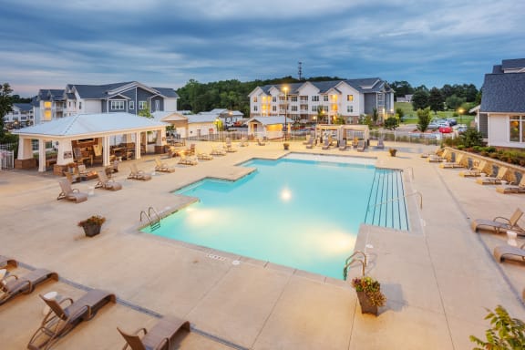 Aerial view of the Station at Poplar Tent swimming pool, sundeck, and outdoor social area in Concord, NC