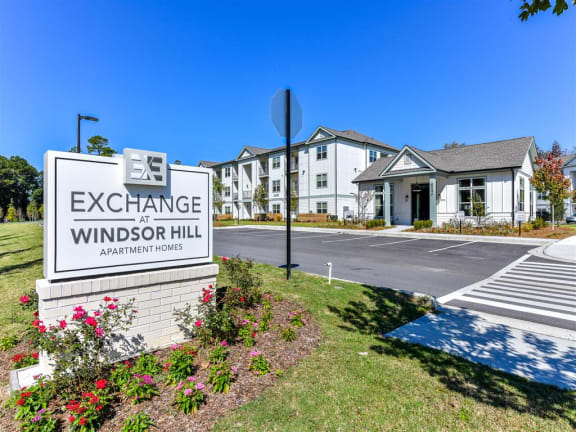 Entrance sign at Exchange at Windsor Hill and exterior of the leasing office in North Charleston, SC
