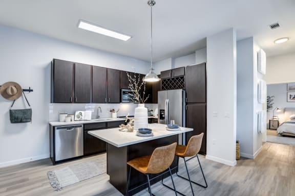 a kitchen and dining area in a 555 waverly unit