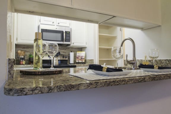 This is a photo of the kitchen of a 1245 square foot 2 bedroom apartment at Cambridge Court Apartments.