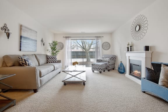 Living Room with Sliding Glass Door at Lakeside Village Apartments Clinton Township MI Living Room with Sliding Glass Door at Lakeside Village Apartments Clinton Township MI
