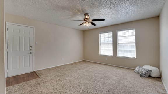 Spacious living room with carpet