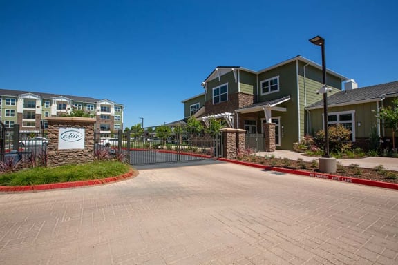 Entry to community with monument signl Alira Apartments in Sacramento Ca