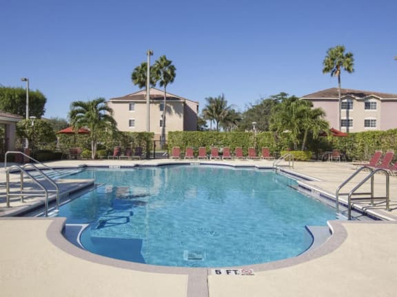 Pool with lounge chairs Doral Terrace in Doral Florida