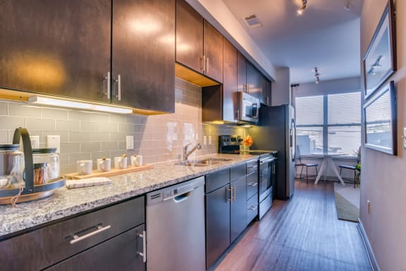 Nashville Apartments - The Carillon Kitchen with Designer Granite Countertops