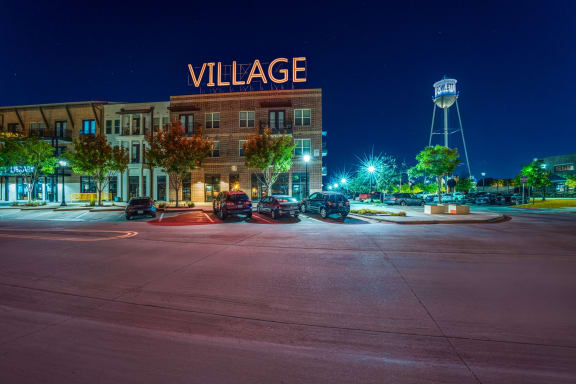 Photo of outside of Village of Rowletts building showing Village sign lit up.