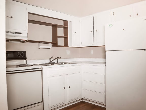 kitchen with oven and refrigerator at northwind apartments