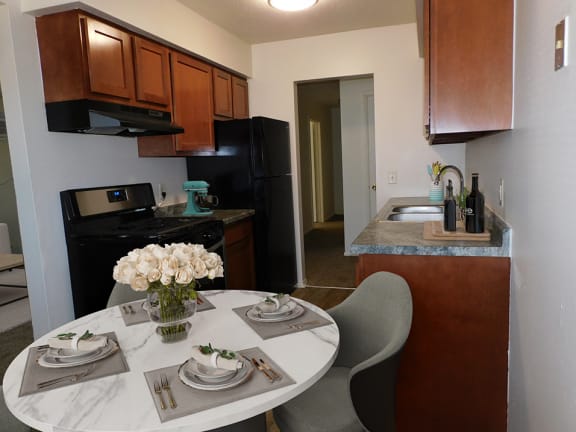 Connected living and dining area at West Broadway Apartments