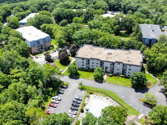 Shrewsburry Commons Apartments in Massachusetts aerial view of pool, leasing office, apartment buildings and tennis courts
