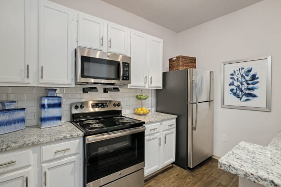 View of kitchen with appliances  at Sandstone Creek in Overland Park, KS