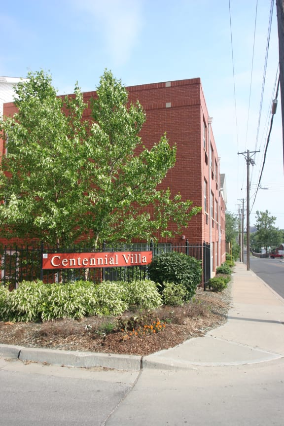 Apartment building exterior and walkway-Centennial Seniors Apartments at Kansas City, MO