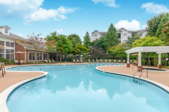 Swimming Pool With Relaxing Sundecks at Riverstone at Owings Mills Apartments, Maryland