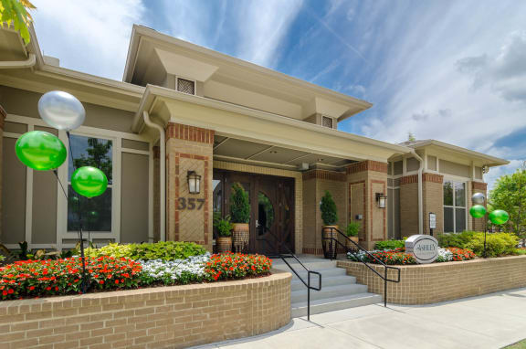 Leasing Office Exterior Office exterior featuring an arrangemnt of flowers at Ashley Auburn Pointe in Atlanta, Ga