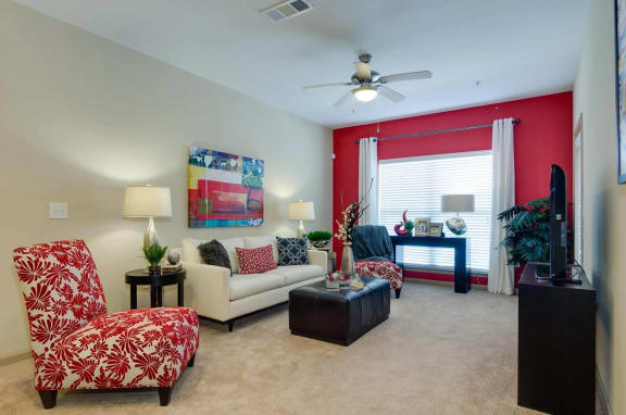 Spacious Living Room Carpeted living room with large windows at Ashley Auburn Pointe in Atlanta, GA