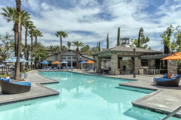 Outdoor pool area with seating