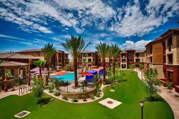 Chandler, AZ Apartments - Exterior View of Elevation Apartments Building Surrounded By Lush Landscaping with Access to the Pool