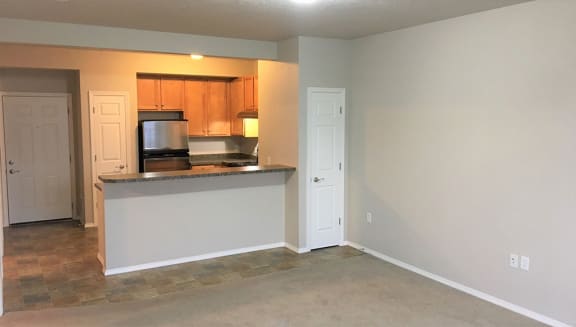Living room , kitchen at Ashlyn Place Apartments, Missoula, Montana