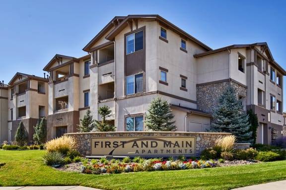 First and Main Apartments welcome sign and landscaping