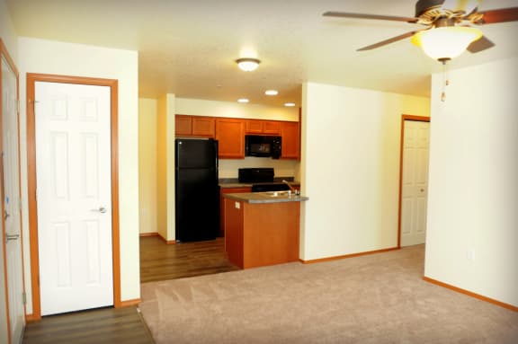 Image of refrigerator, stove, microwave, sink and  cabinets