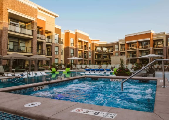 An outdoor pool at an apartment home complex