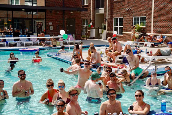 Image of Residents participating in a Greenway Pool Party at Greenway at Fisher Park, Greensboro, NC, 27401