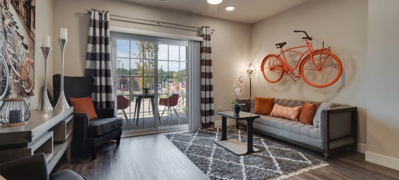 Living Room With Glass Sliding Patio Door & Wood-Style Flooring