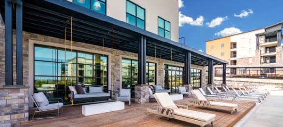Lounging By The Pool at Soleil Lofts Apartments, Herriman, UT