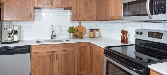 Kitchen with Wood Cabinets and White Counter Tops