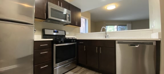Upgraded kitchen with rich wood cabinetry