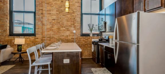Kitchen with a breakfast bar at Carriage House Lofts, Chicago, IL