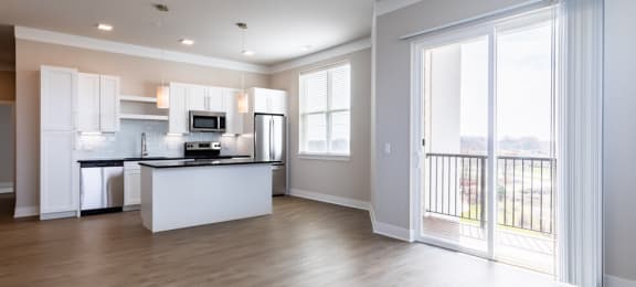 Open layout with gorgeous flooring and access to private balcony