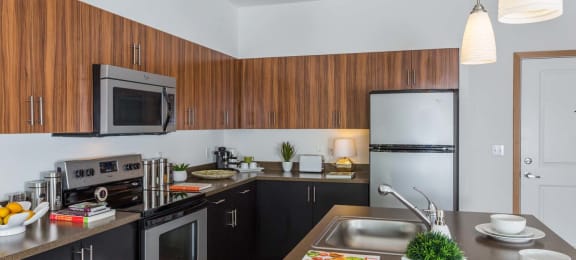Fully Equipped Kitchen With Modern Appliances at Tivalli Apartments, Lynnwood, WA