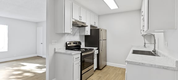 Doriana Apartments in San Diego full kitchen with stainless steel appliances