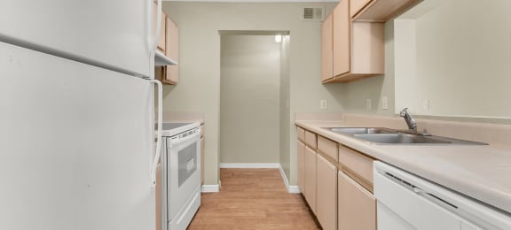 La Mirada Gardens Apartments in Bradenton, FL photo of white kitchen appliances