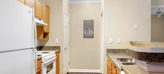 Kitchen with oven and fridge at Longwood Vista Apartments in Atlanta GA