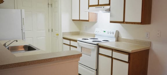 Kitchen space at Whispering Oaks Apartments in Portsmouth VA