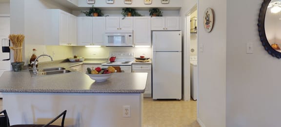 Apartments in North Dallas TX - Tivoli - Spacious Kitchen with White Appliances and Cabinetry, and Plenty of Counter Space